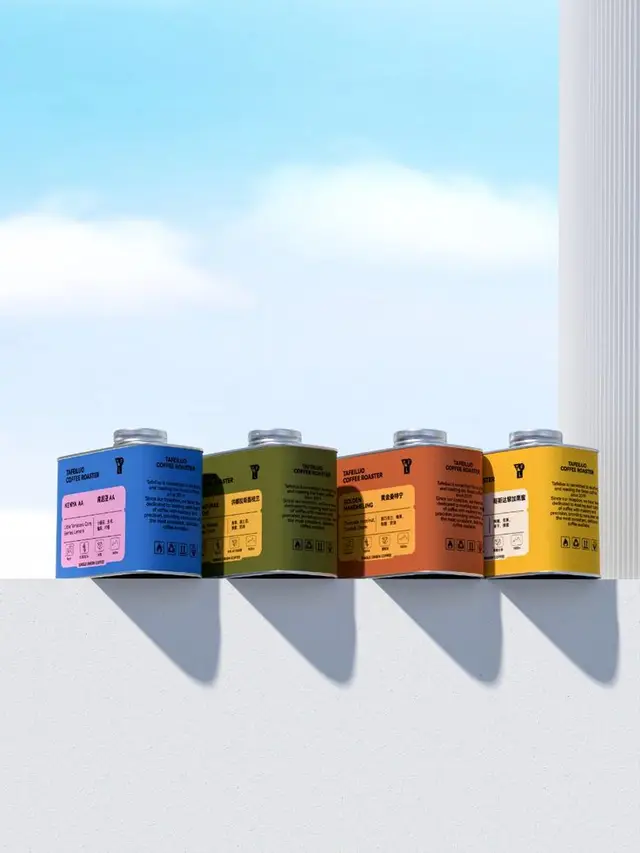 Colorful coffee canisters on white ledge against blue sky
