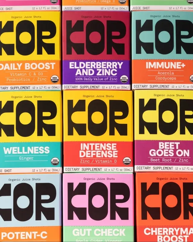 KOR organic juice shot boxes — colorful stacked packaging grid