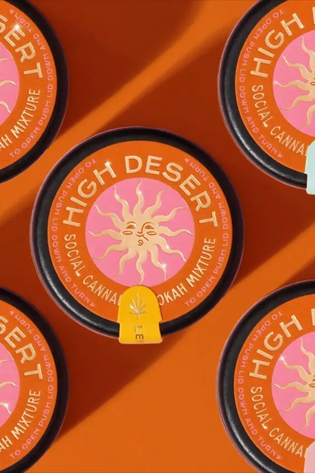 HIGH DESERT orange round tins — cannabis hookah mixture packaging with pink sun logo