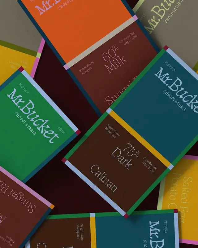Mr.Bucket color-block chocolate bar packaging — 75% Dark Calinan & 60% Milk