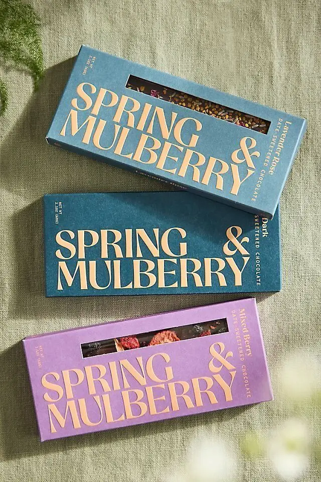 Spring & Mulberry date‑sweetened chocolate — teal and lavender serif packaging