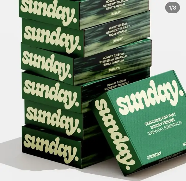 sunday. branded green packaging — stacked boxes
