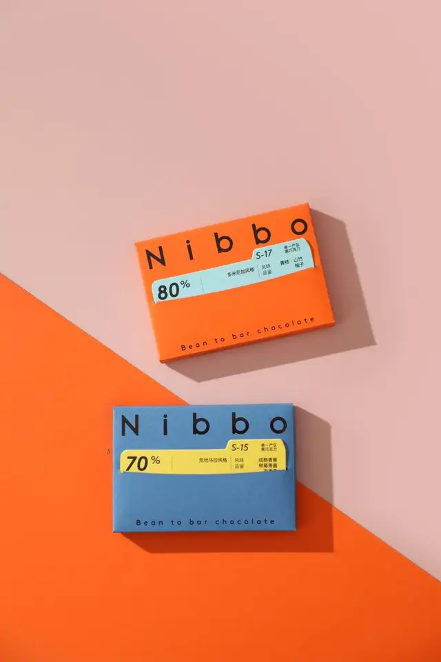 Nibbo bean-to-bar chocolate packaging — orange 80% and blue 70% bars