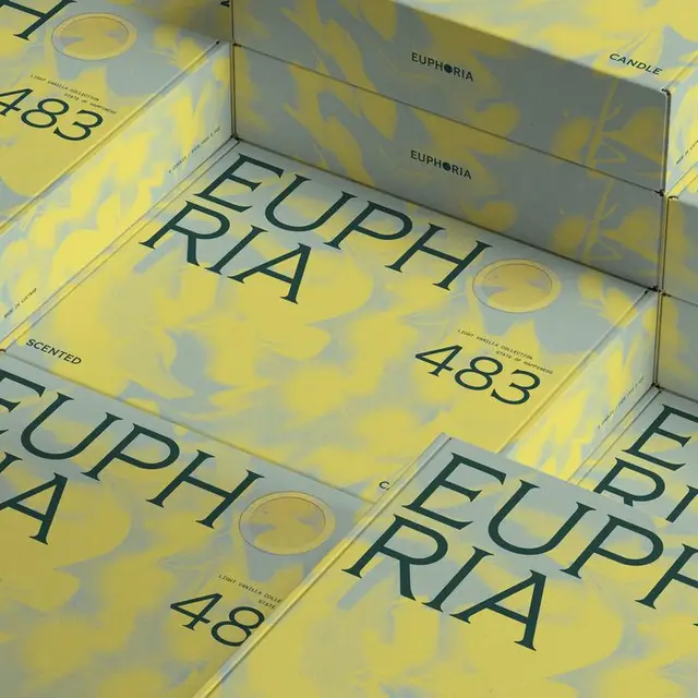 EUPHORIA 483 scented candle — yellow marbled boxed packaging