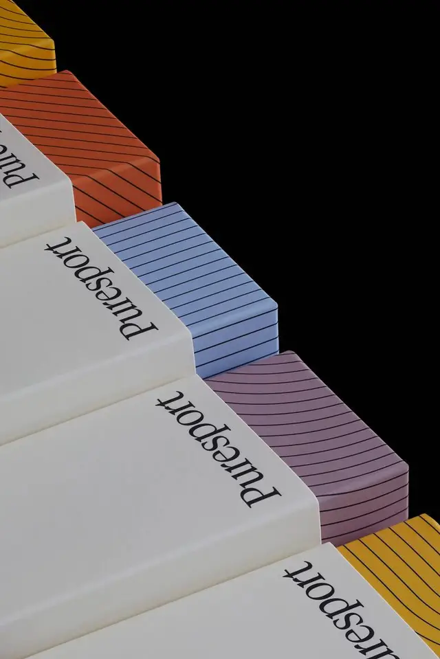 Stacked 'Puresport' book spines with striped color-block covers