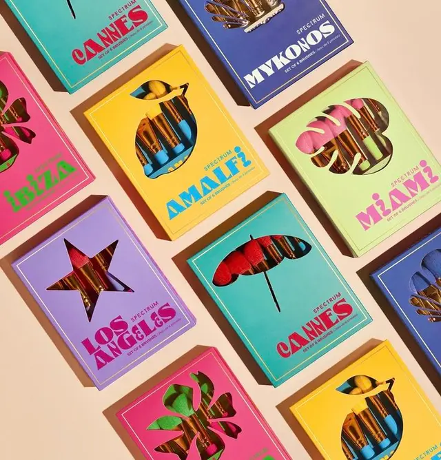 Spectrum travel-themed makeup brush sets — colorful die-cut packaging