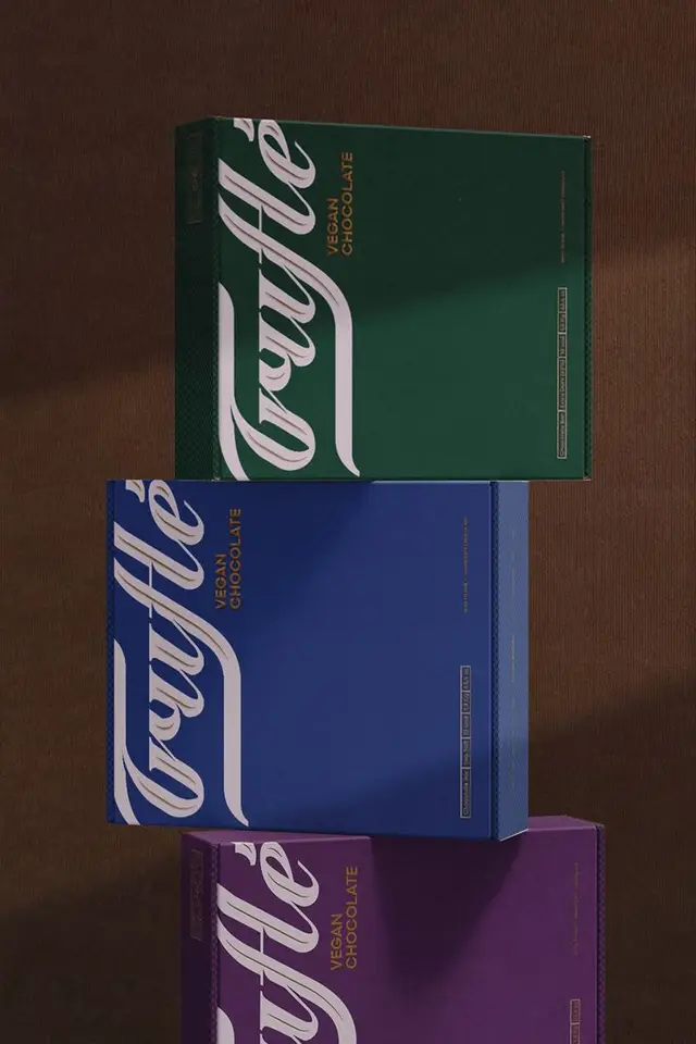 Trayfle vegan chocolate — stacked green, blue and purple packaging