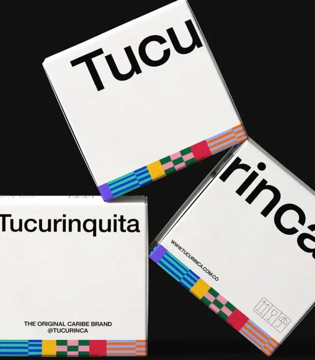 Tucurinca white packaging with multicolor geometric band