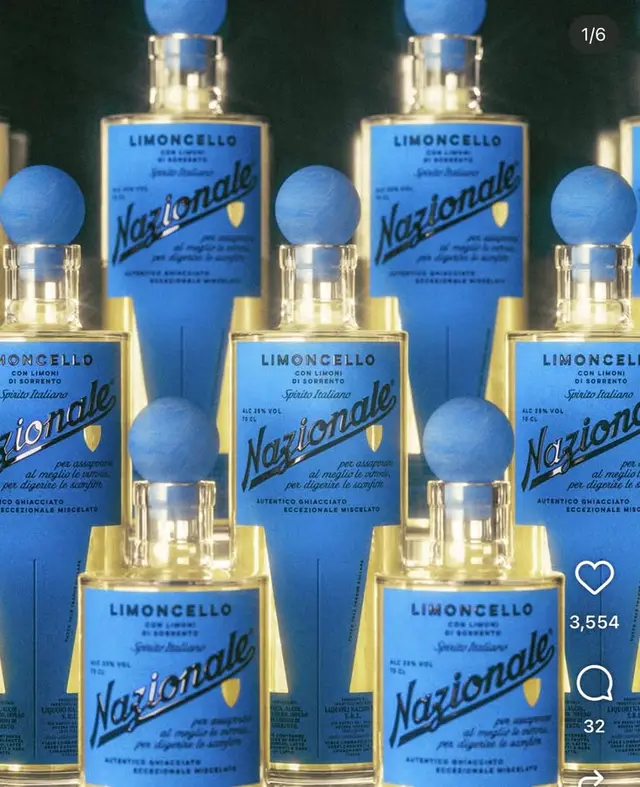 Blue‑labeled Nazionale Limoncello bottles with spherical blue stoppers