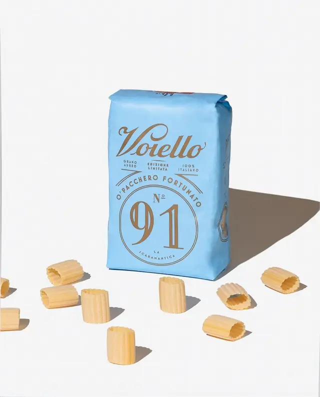 Voiello N°91 light-blue pasta bag with rigatoni — minimalist product shot