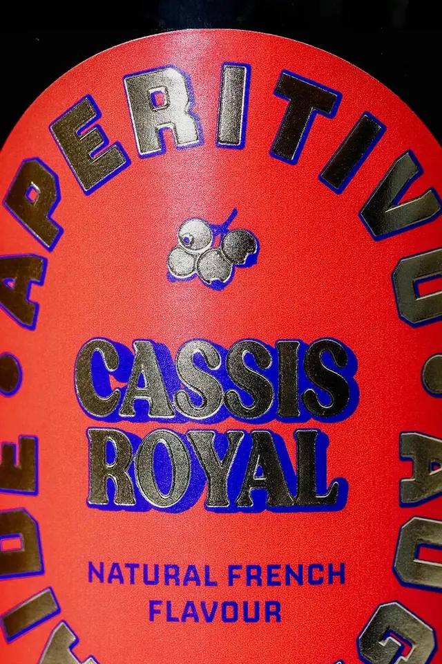 Cassis Royal red liqueur label — embossed close-up