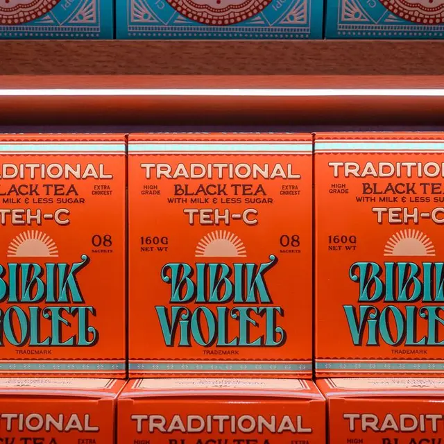 Bibik Violet Traditional Black Tea — orange boxes with turquoise logo