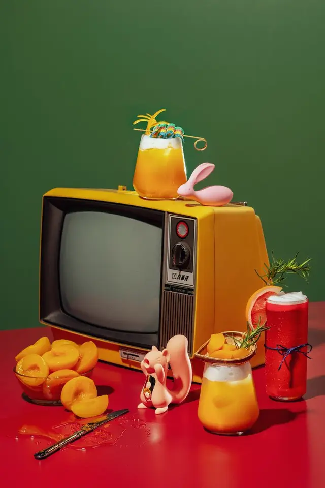 Retro yellow CRT still life with cocktails and peaches