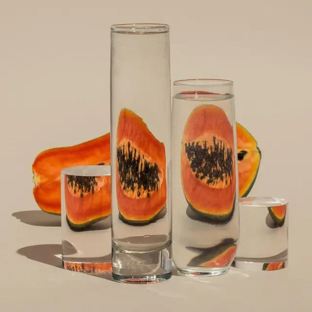 Papaya Refractions — Still Life with Glass Cylinders