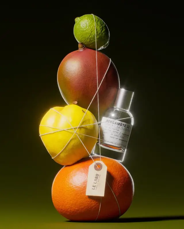Le Labo Bergamote 22 still life with stacked citrus fruits