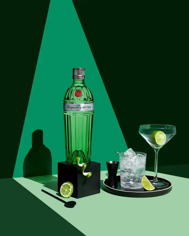 Tanqueray No. Ten still-life with martini, rocks glass and lime