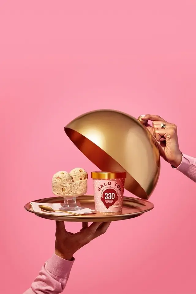 Halo Top pint on gold tray under cloche — pink studio product shot