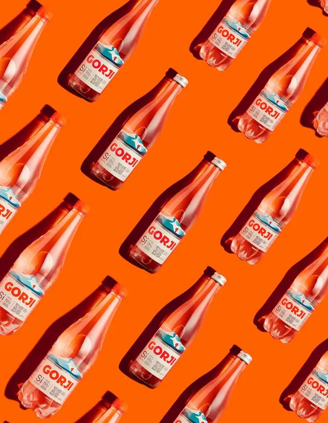 GORJI bottles pattern on bright orange background