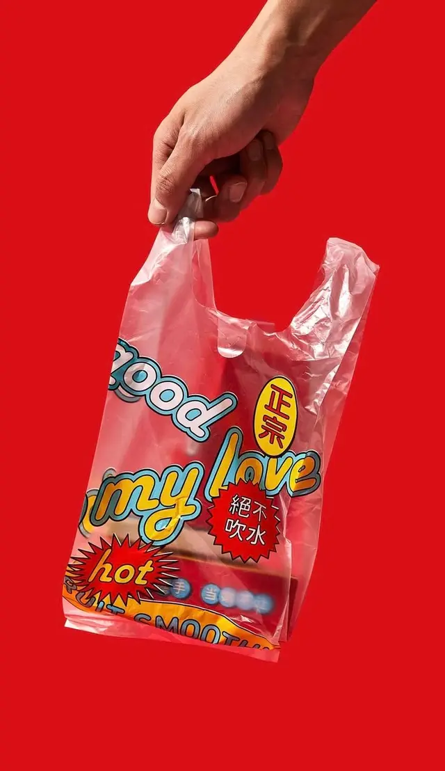 Translucent plastic takeout bag with 'my love' graphic on red background