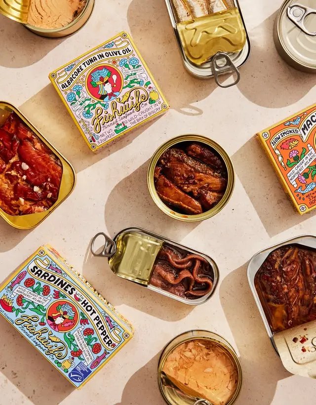 Fishwife canned seafood flatlay — sardines, albacore tuna, mackerel in tins