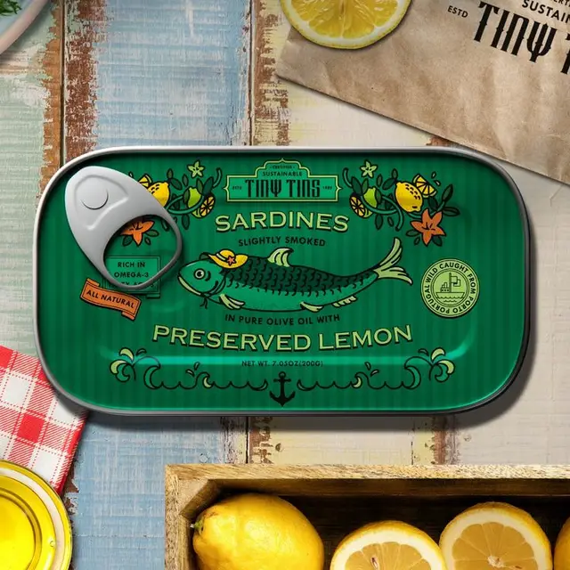Green Tiny Tins sardine tin — Preserved Lemon packaging on rustic wood