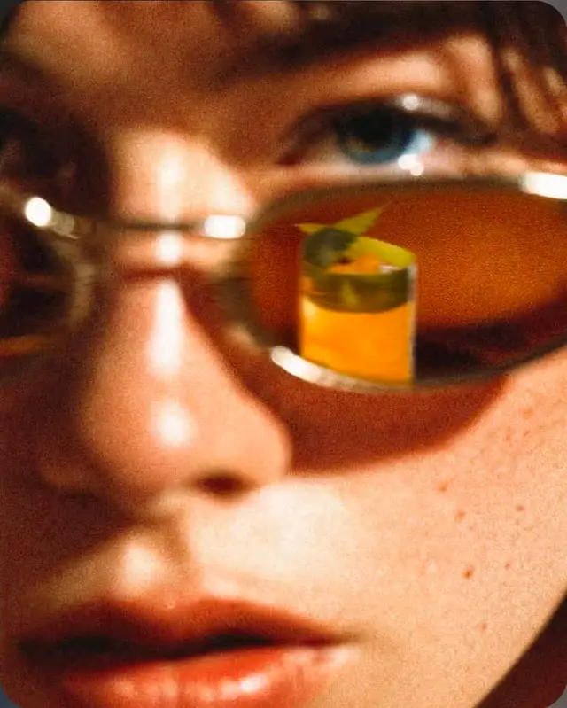 Close-up with Amber Sunglasses Reflecting Cocktail