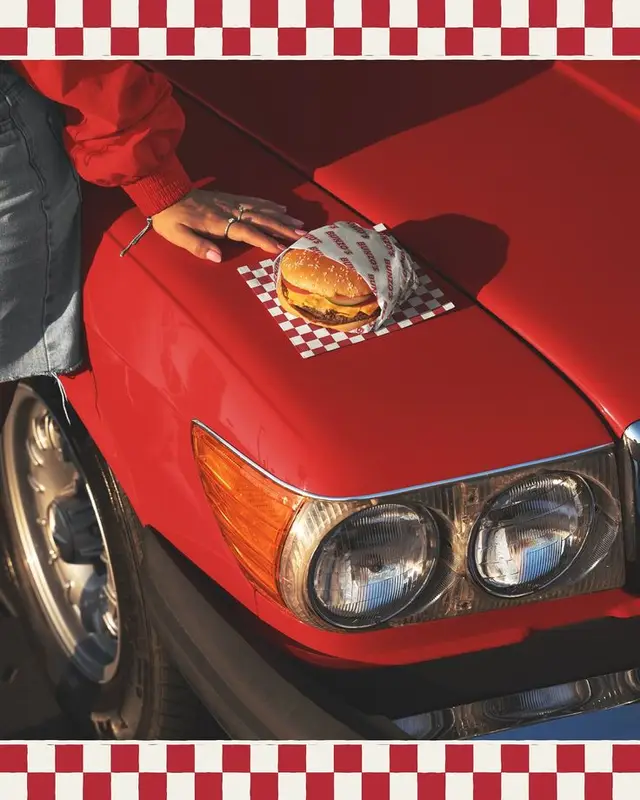 Cheeseburger on Vintage Red Car Hood — Checkerboard Diner Aesthetic