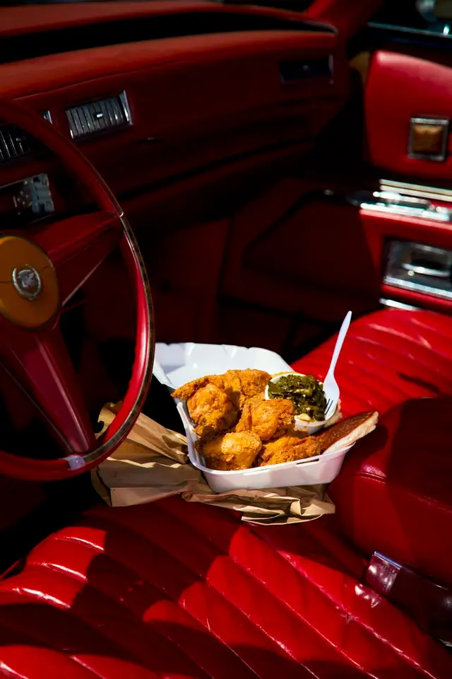 Takeout Fried Chicken on Red Vintage Car Bench Seat