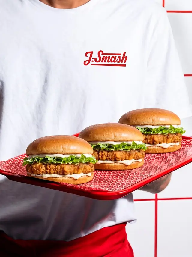 J.Smash chicken sandwiches on red service tray — product shot