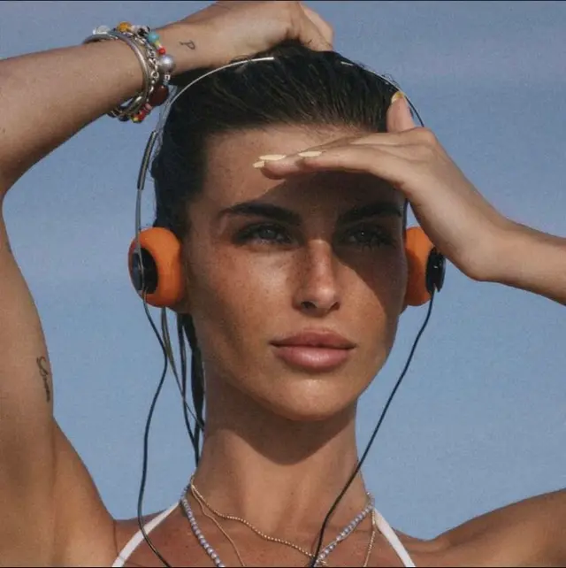 Sunkissed portrait with orange retro on-ear headphones