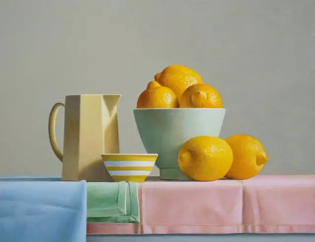 Still life with lemons in a mint bowl, geometric pitcher and pastel tablecloths