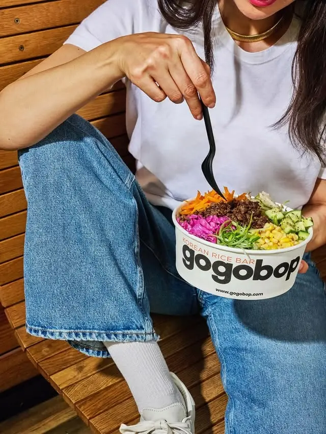 Gogobop colorful Korean rice bowl on wooden bench