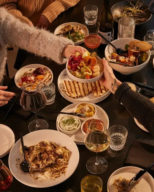 Cozy mezze-style dinner with grilled flatbread and wine