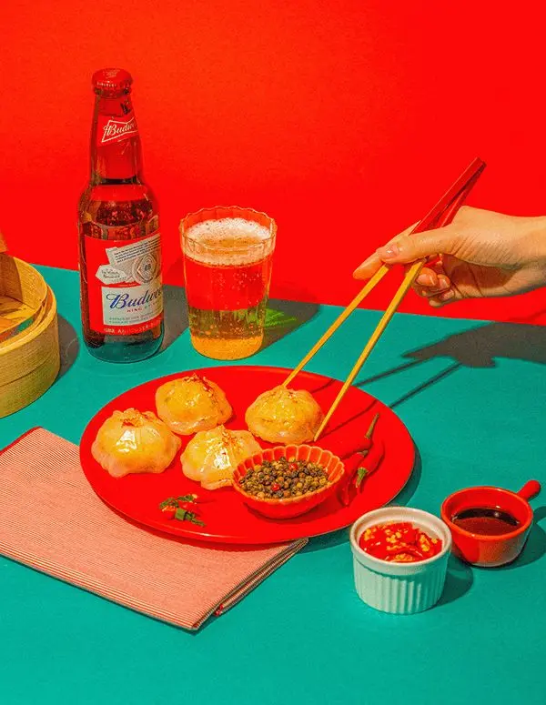Budweiser and Steamed Dumplings on Red Plate — Color‑block Food Still Life