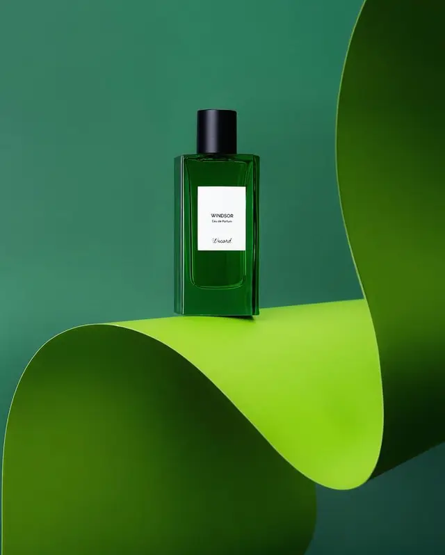 WINDSOR Eau de Parfum — green glass bottle on curved lime backdrop