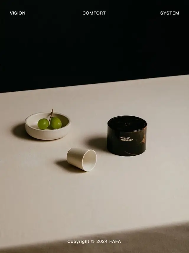 Minimal still life with white bowl, green grapes, small cup and black jar (Copyright FAFA