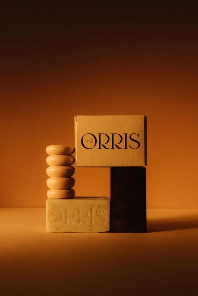 ORRIS soap and kraft box still life — warm amber studio shot