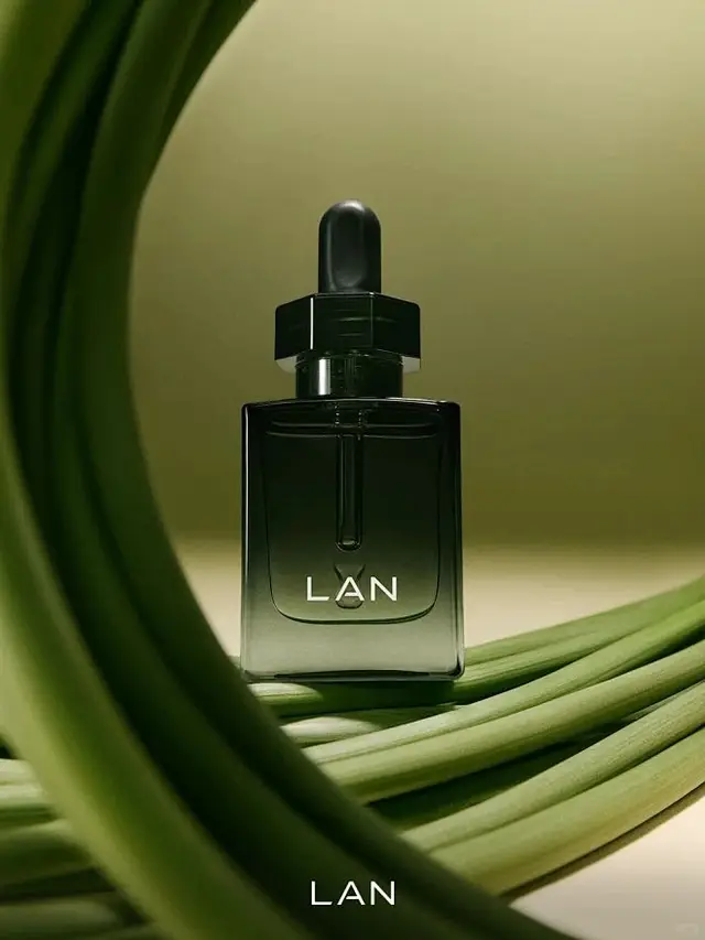 LAN dark green glass dropper bottle studio product shot