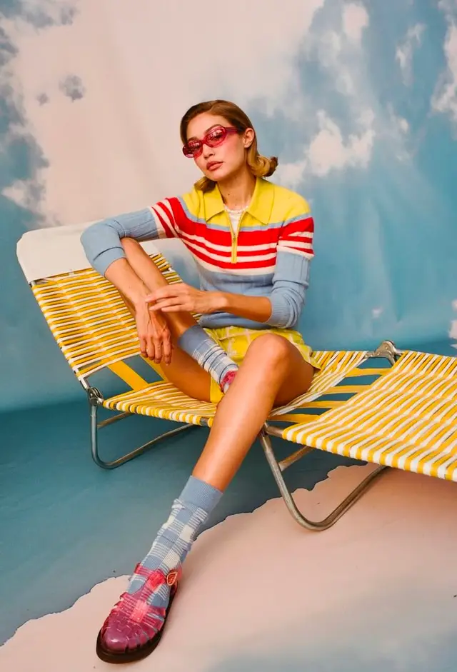 Retro striped polo and yellow lounge chair — studio fashion editorial