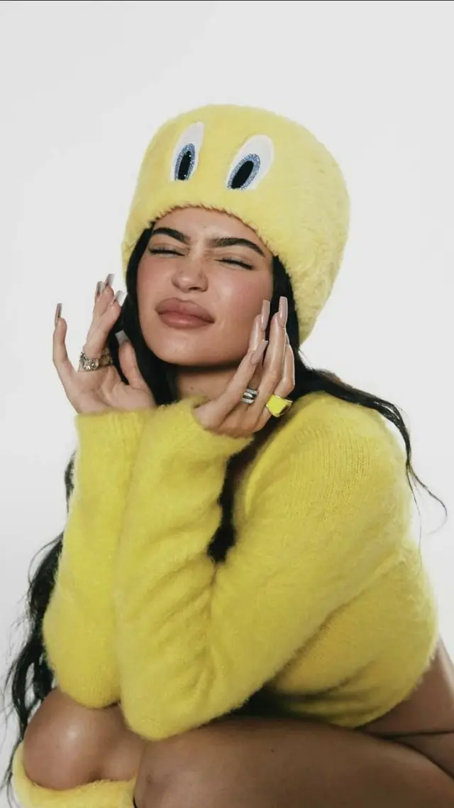 Yellow plush beanie and fuzzy cropped sweater — studio portrait