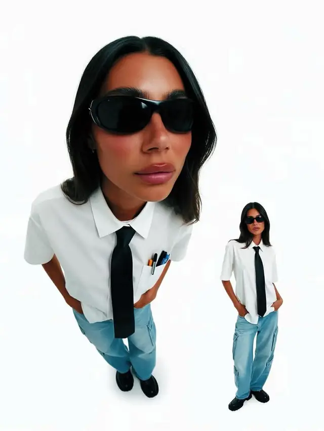 Y2K editorial: white short-sleeve shirt with black tie and light-blue cargo jeans