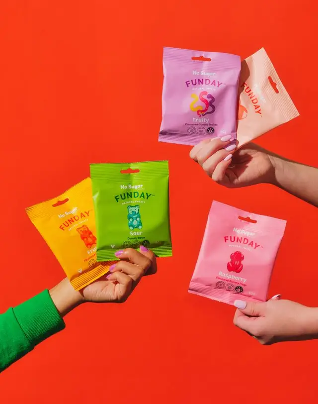 FUNDAY no-sugar gummy pouches on bright red backdrop