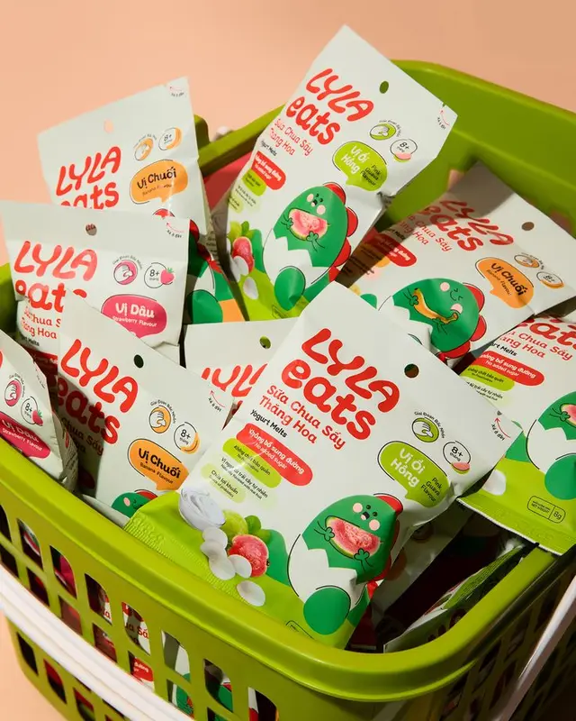 LYLA eats freeze-dried yogurt snack pouches in green basket