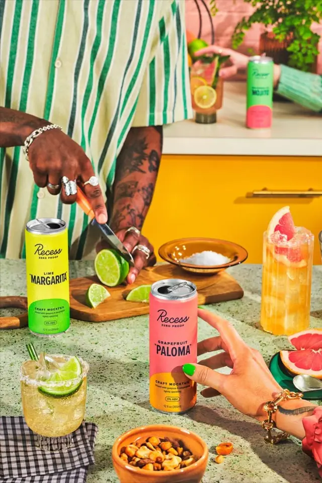 Recess Grapefruit Paloma & Lime Margarita cans on a styled kitchen counter