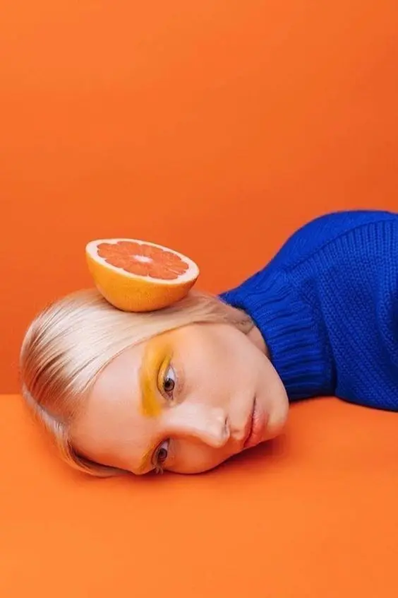 Cobalt Knit and Grapefruit — Orange Color‑Block Fashion Portrait