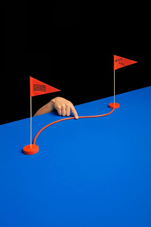 Studio composition — red flag route with pointing hand ("MAC VAL")