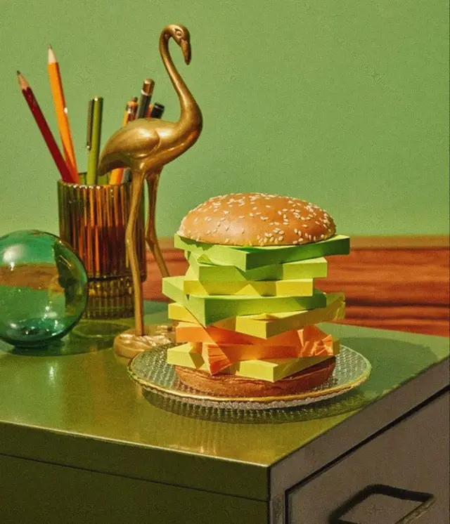 Sticky-note hamburger still life with brass flamingo