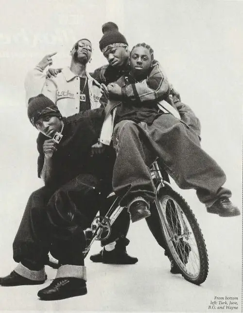 From bottom left: Turk, Juvenile, B.G. and Wayne — 1990s hip‑hop group studio portrait