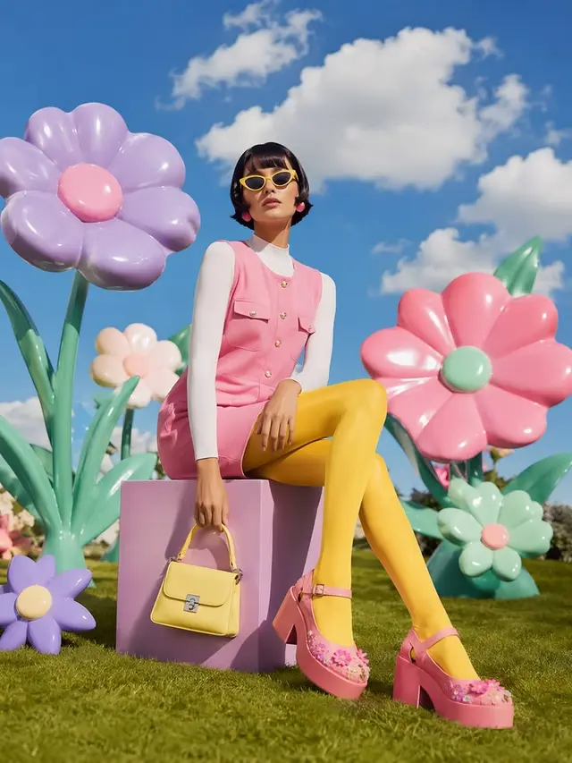 Retro mod fashion portrait with oversized pastel flowers