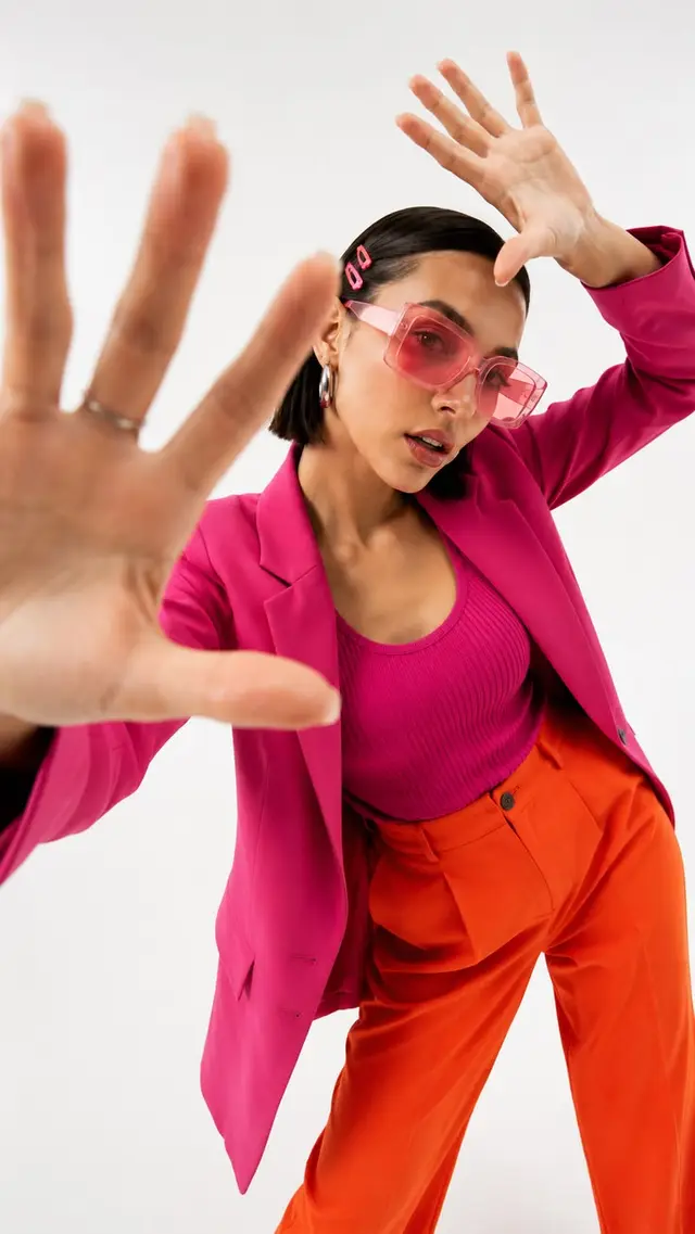 Color-block fashion portrait — hot pink blazer & orange trousers